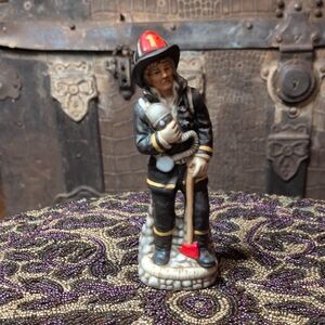 Heroic Firefighter Figurine with Red and Black Details
